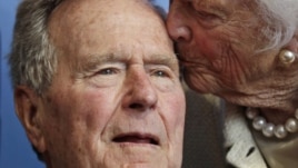 Former President George H.W. Bush, and his wife former first lady Barbara Bush, arrive for the premiere of HBO's new documentary on his life near the family compound in Kennebunkport, Maine,June 12, 2012.