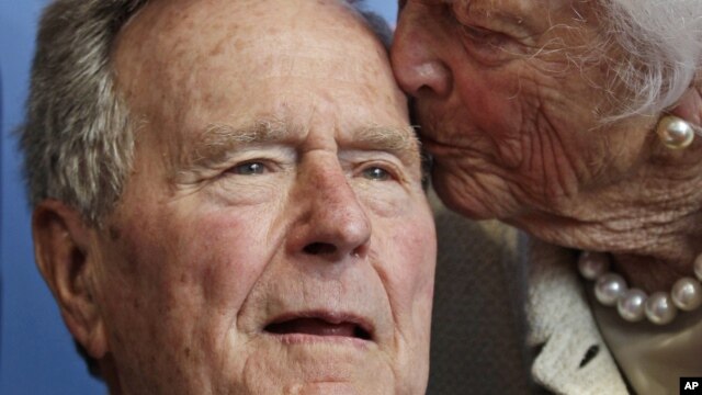 Former President George H.W. Bush, and his wife former first lady Barbara Bush, arrive for the premiere of HBO's new documentary on his life near the family compound in Kennebunkport, Maine,June 12, 2012.