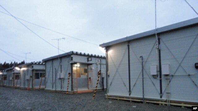 This week, several dozen families began moving into temporary housing on the grounds of a school in Rikuzentakata in Iwate Prefecture, Japan, April 11, 2011.
.