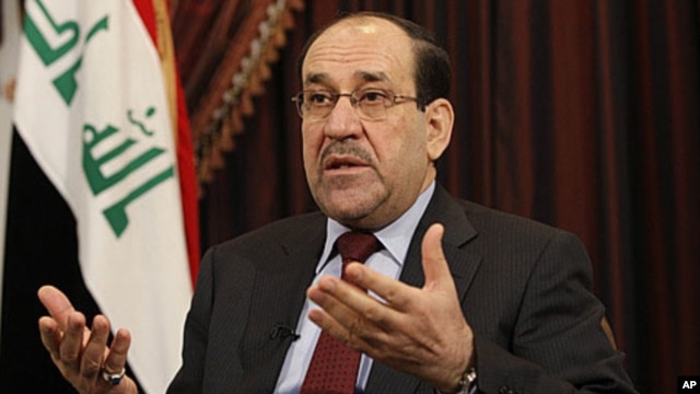 Iraq's Prime Minister Nouri al-Maliki speaks during an interview with The Associated Press in Baghdad, Iraq, Saturday, December 3, 2011.