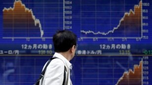 An electronic board displays currency rates outside a brokerage in Tokyo, May 23, 2013.