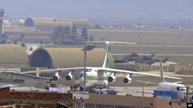 An Iranian airplane, which officials said was forced to land in southeast Turkey on Tuesday on suspicion that it may have been carrying arms to Syria, sits at the tarmac at Diyarbakir airport, March 16, 2011