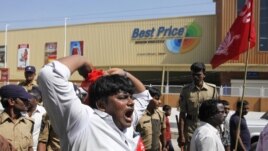 India’s leftist party activists shout slogans during a protest in front of a Bharti Walmart Best Price wholesale store in Hyderabad, India, November 19, 2102.