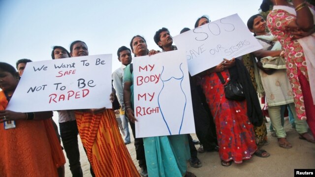 Demonstrators hold placards as they take part in a protest rally in solidarity with a rape victim from New Delhi in Mumbai, December 27, 2012.