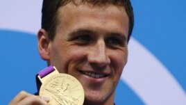 Ryan Lochte of the U.S. poses with his gold medal on the podium after winning the men's 400m individual medley final at the London 2012 Olympic Games at the Aquatics Centre July 28, 2012.