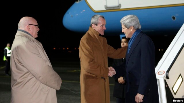 U.S. Secretary of State John Kerry (R) is greeted by U.S. Ambassador to Germany Philip Murphy (C) on arrival at Tegel International Airport in Berlin, February 25, 2013