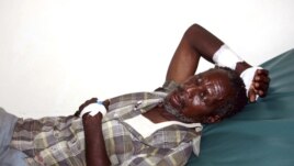 A victim of the Tana River clashes between the pastoralists and farmers within the delta region rests inside a ward at the Malindi District hospital in Kenya, September 7, 2012.