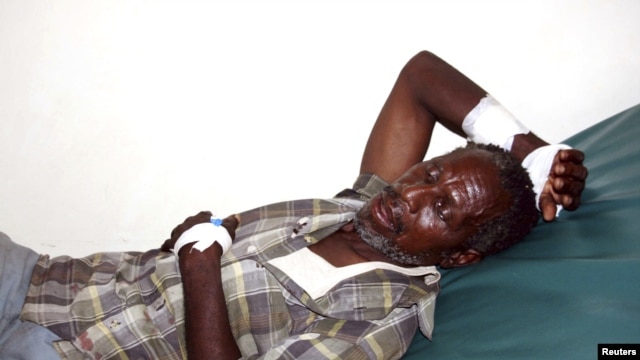 A victim of the Tana River clashes between the pastoralists and farmers within the delta region rests inside a ward at the Malindi District hospital in Kenya, September 7, 2012.