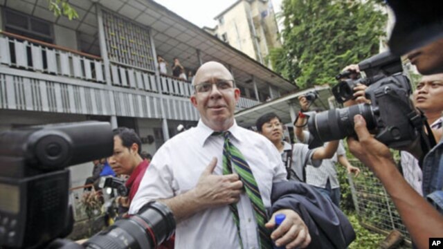 Australian journalist Ross Dunkley, co-founder of the Myanmar Times, talks to reporters after his court hearing at Kamaryut township in Yangon, June 30, 2011