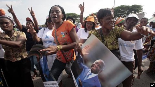 Women show support to Ivory Coast President Laurent Gbagbo during a rally called by Ivory Coast youth minister Charles Ble Goude and others in Abidjan, Ivory Coast.