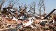 Zach Champion walks through the rubble of his mobile home looking for his belongings, in the Steelman Estates Mobile Home Park, destroyed in Sunday's tornado, near Shawnee, Oklahoma, May 20, 2013.