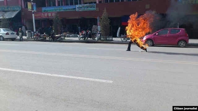 Citizen journalist image shows Tibetan man self-immolating in Labrang, China, October 23, 2012.