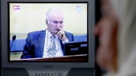 Mejra Dzogaz watches the television broadcast of the court proceedings of former Bosnian Serb general Ratko Mladic's in her home in Potocari, near Srebrenica, May 17, 2012