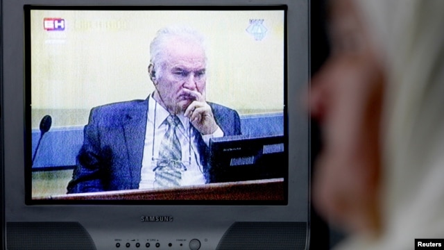 Mejra Dzogaz watches the television broadcast of the court proceedings of former Bosnian Serb general Ratko Mladic's in her home in Potocari, near Srebrenica, May 17, 2012