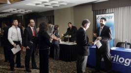 Job seekers line up at a job fair in Boston. While overall unemployment for Asian-Americans remains below the national average, their rate of long-term unemployment is the highest. 