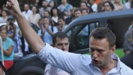 FILE - In this file photo taken on Friday, Aug. 17, 2012, Russian protest leader Alexei Navalny gestures as he walks outside a court in Moscow, Russia. 