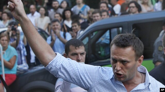 FILE - In this file photo taken on Friday, Aug. 17, 2012, Russian protest leader Alexei Navalny gestures as he walks outside a court in Moscow, Russia. 