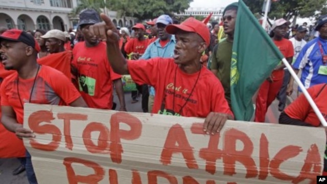 Protesters shout during a climate change rally outside the climate change summit held in the city of Durban, South Africa, December 2, 2011.