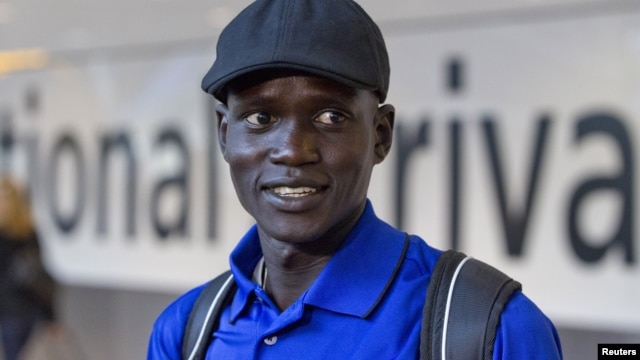 Marathon runner Guor Marial arrives at Heathrow Airport for the London 2012 Olympic Games, August 3, 2012. 