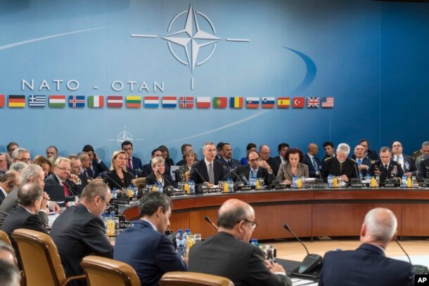 FILE - NATO defense ministers are seated during a meeting of the North Atlantic Council Defense Ministers session at NATO headquarters in Brussels, Oct. 27, 2016.