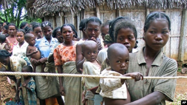 Madagascar mothers line up with their malnourished children to see a doctor in the island's southeast isolated district of Vangaindrano in this picture taken in Jan 2006