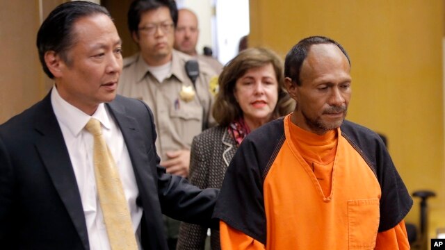 FILE - Juan Francisco Lopez-Sanchez (R), charged with the murder of 32-year-old Kate Steinle, is seen being escorted into a courtroom at the Hall of Justice in San Francisco, California, July 7, 2015.
