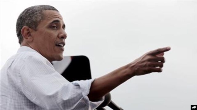 President Barack Obama speaks during a Labor Day event at Detroit's Renaissance Center, headquarters of General Motors,  Sept., 5, 2011