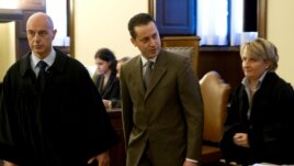 The pope's butler Paolo Gabriele, center, flanked at right by his lawyer Cristiana Arru, leaves the Vatican tribunal, after the verdict, at the Vatican, October 6, 2012.  