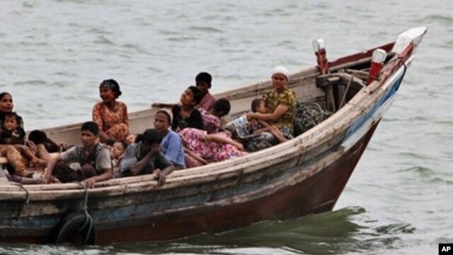 Burmese Rohingya Muslims fleeing religious violence are intercepted by Bangladesh border authorities, Taknaf, Bangladesh, June 13, 2012.