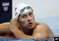 United States' Ryan Lochte checks his time in a men's 4x200-meter freestyle heat during the swimming competitions at the 2016 Summer Olympics, in Rio de Janeiro, Brazil, August 9, 2016.