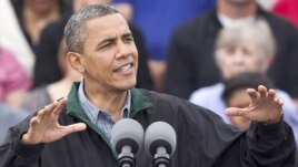 President Barack Obama speaks during a campaign stop in Council Bluffs, Iowa, August 13, 2012.