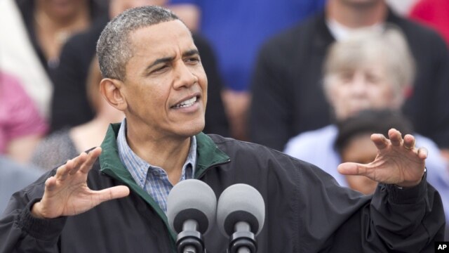 President Barack Obama speaks during a campaign stop in Council Bluffs, Iowa, August 13, 2012.