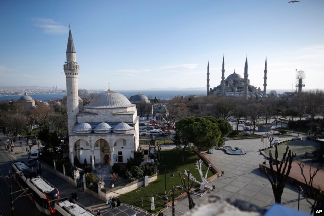 A view of the Sultan Ahmed Mosque, right, better known as the Blue Mosque in the historic Sultanahmet district of Istanbul, the area of an explosion, Jan. 12, 2016.