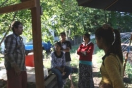 Farm program manager David Beller talks to refugee farmers Pabi Tiwari, Guman Bharati, Jumuna Bharati and Pabitra Tiwari.