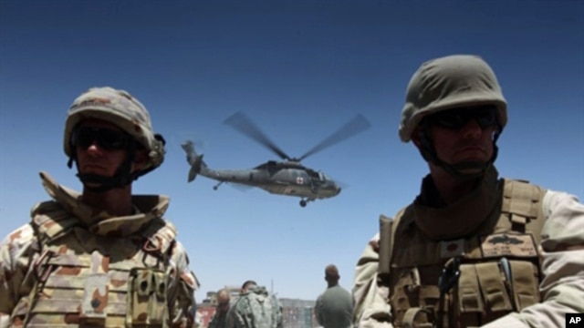 A medevac helicopter lifts off from Camp Nathan Smith in Kandahar city, carrying an unidentified NATO soldier on 9 June 2010
