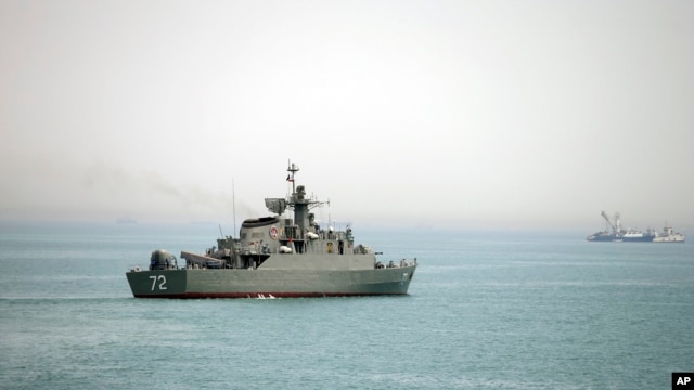 In this picture taken on April 7, 2015, and released by the semi-official Fars News Agency, Iranian warship Alborz, is seen in the Strait of Hormuz. Tehran has threatened to close the waterway to U.S. and allied vessels.