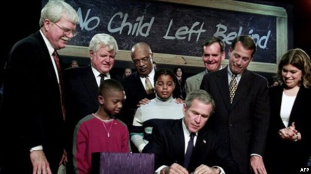 President George W. Bush signs the federal education bill known as No Child Left Behind at Hamilton High School in Hamilton, Ohio, in 2002