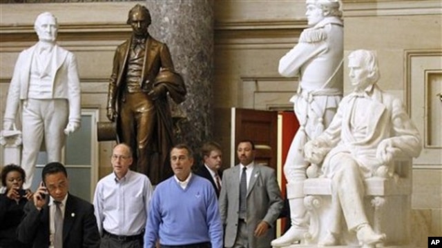 House Speaker-in-waiting John Boehner, of Ohio, center, Republican Majority Transition Chairman Rep. Greg Walden, R-Ore., second from left, and others walk to a news conference on Capitol Hill in Washington, 10 Nov 2010