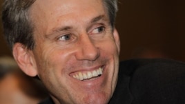 In this photo taken Monday, April 11, 2011, then U.S. envoy Chris Stevens attends meetings at the Tibesty Hotel where an African Union delegation was meeting with opposition leaders in Benghazi, Libya.