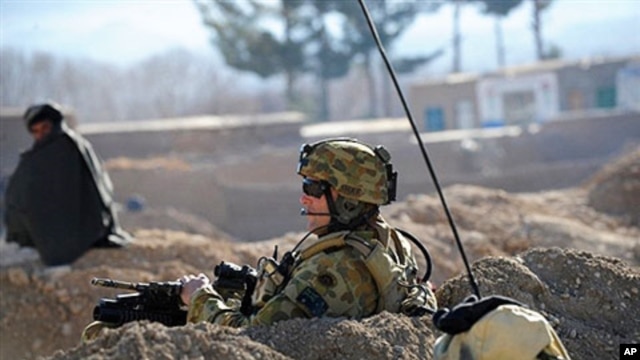 An Australian soldier takes position during a NATO/ISAF joint task force patrol in Mirwais in the southern province of Uruzgan in Afghanistan (File)