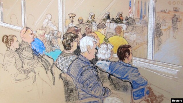 Family members of victims and Office of Military Commissions staff watch pretrial hearings for alleged conspirators in the 9/11 attacks, Guantanamo Bay, Cuba, Jan. 28, 2013.