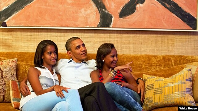 President Barack Obama and his daughters, Malia (l) and Sasha, watch on TV as First Lady Michelle Obama delivers her speech at the Democratic National Convention, Sept. 4, 2012. (Official White House Photo by Pete Souza)