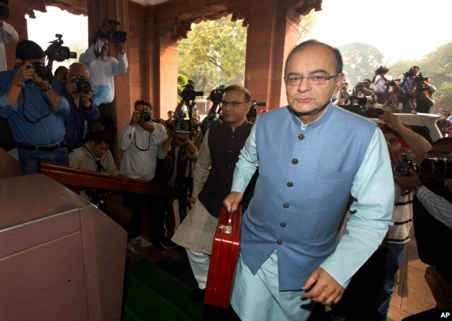 FILE - Indian Finance Minister Arun Jaitley arrives at parliament house to present federal budget 2016-17, in New Delhi, India, Feb. 29, 2016