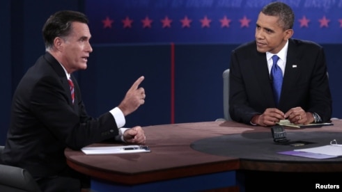 U.S. Republican presidential nominee Mitt Romney makes a point as U.S. President Barack Obama listens during the final U.S. presidential debate in Boca Raton, Florida, October 22, 2012.