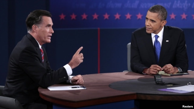 U.S. Republican presidential nominee Mitt Romney makes a point as U.S. President Barack Obama listens during the final U.S. presidential debate in Boca Raton, Florida, October 22, 2012. 
