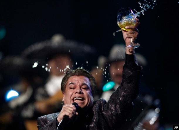 Obit Juan Gabriel: FILE - In this Nov. 5, 2009, file photo, Juan Gabriel performs at the 10th Annual Latin Grammy Awards in Las Vegas. The press office for Mexican superstar Gabriel says the singer has died at age 66.
