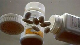 Samples of Nevirapine, an antiretroviral AIDS drug used since the 1990s, are displayed at the National Institutes of Health in Memphis, Tenn.  (AP Photo/APTN)