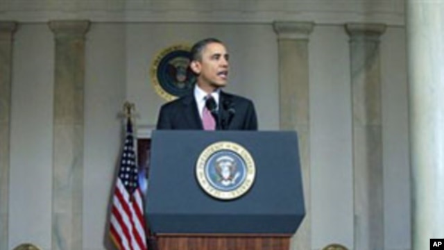 President Barack Obama makes a statement on the resignation of Egypt's President Hosni Mubarak in the Grand Foyer at the White House, February 11, 2011
