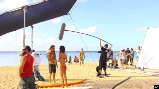 "Hawaii Five-0" stars Scott Caan and Grace Park film on location on the beach.