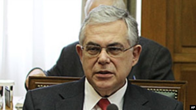 Greek Prime Minister Lucas Papademos attends a cabinet meeting at the Greek Parliament in Athens, March 9, 2012.